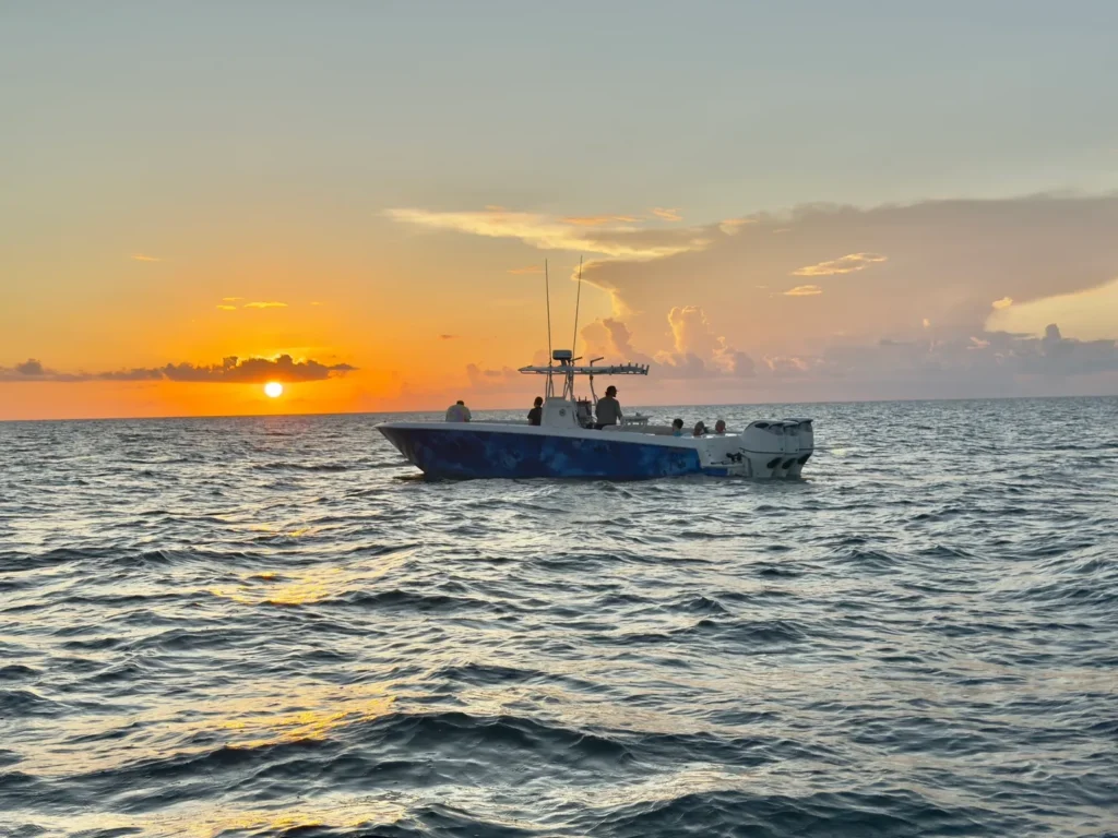 Key West sunset cruise on a charter boat with guests relaxing on board